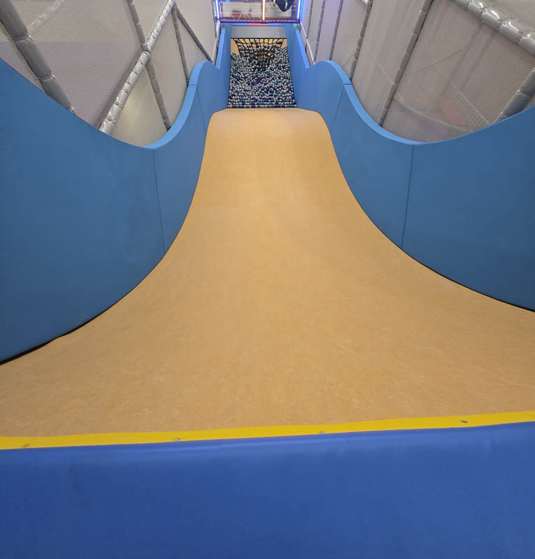 Drop Slide adventure at Cosmic Air in Webster, TX, indoor fun park.