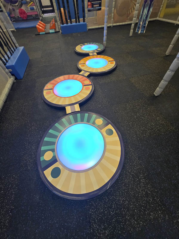 LED Floor Jumper attraction at Cosmic Air indoor park, Webster, Texas.