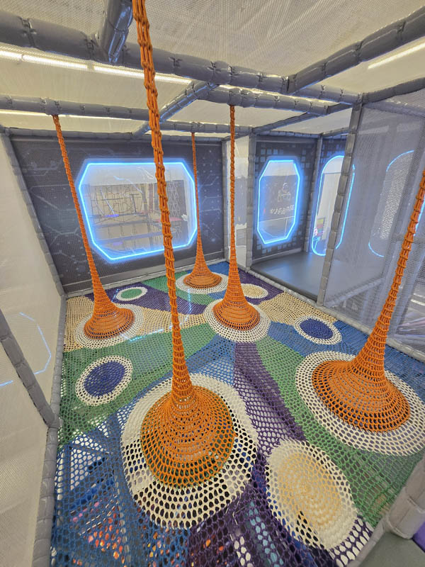 Rainbow Net attraction at Cosmic Air indoor park, Houston, Texas.