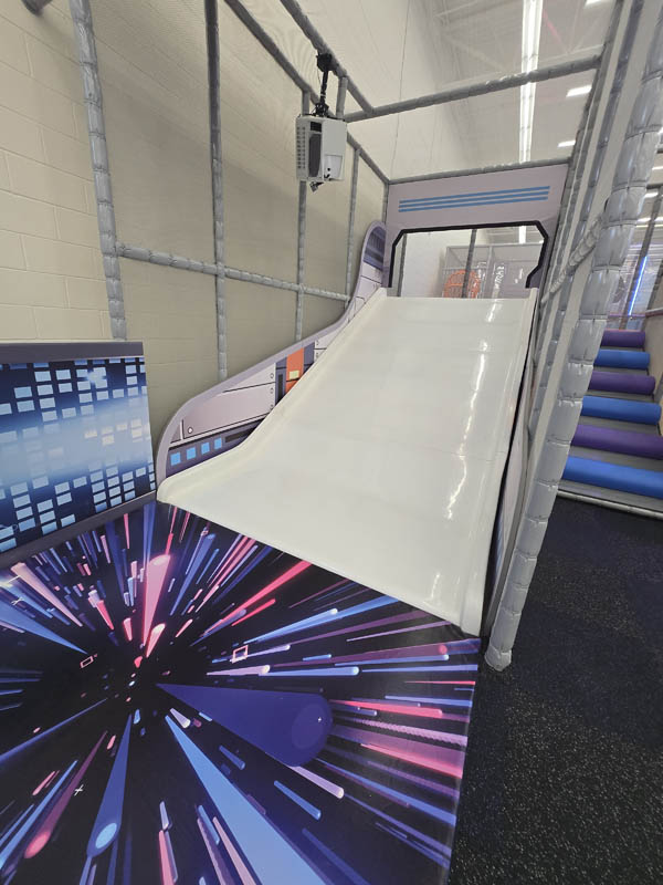 Interactive Toddler Slide at Cosmic Air indoor adventure park in Webster, TX.